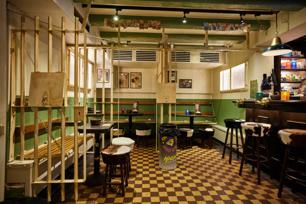 Once a police station, now a coffeeshop icon. Explore the jail-inspired interior of The Bulldog Palace and smoke where rules were rewritten.