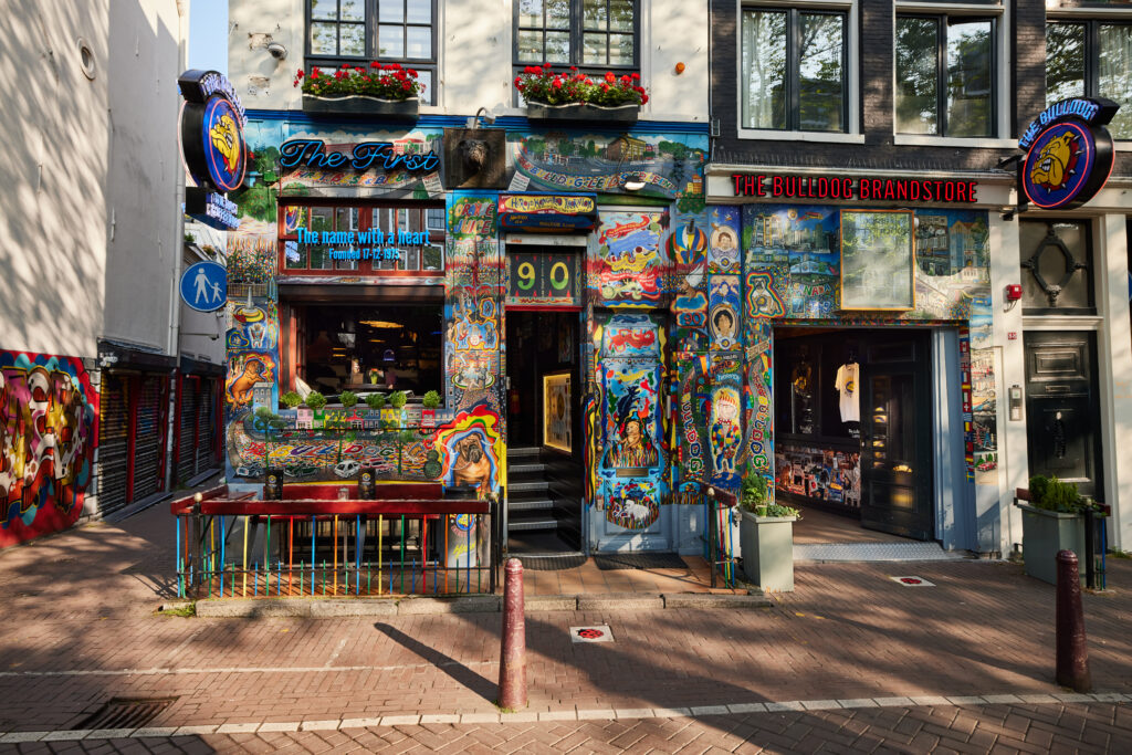 Colourful exterior of The Bulldog's original coffeeshop at number 90, next to The Bulldog Brandstore on Oudezijds Voorburgwal, Amsterdam.