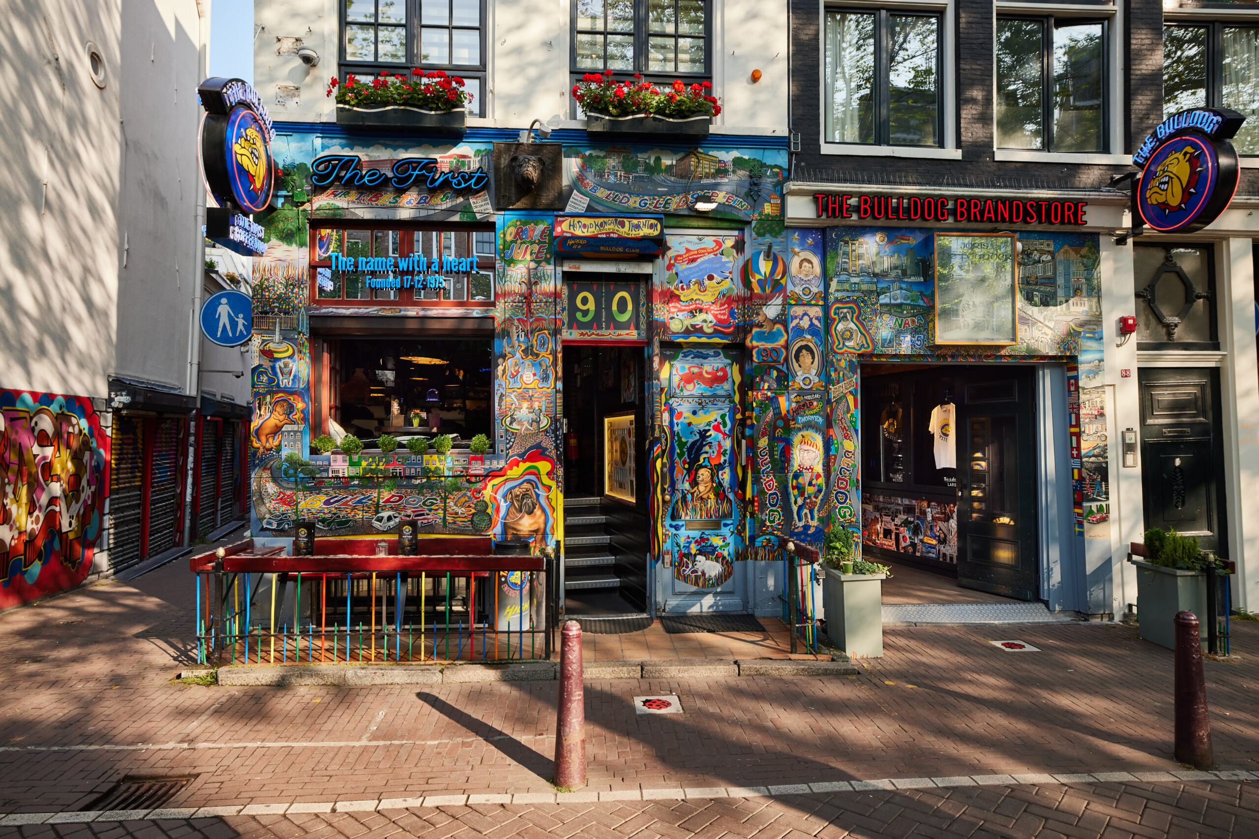 Colourful exterior of The Bulldog's original coffeeshop at number 90, next to The Bulldog Brandstore on Oudezijds Voorburgwal, Amsterdam.