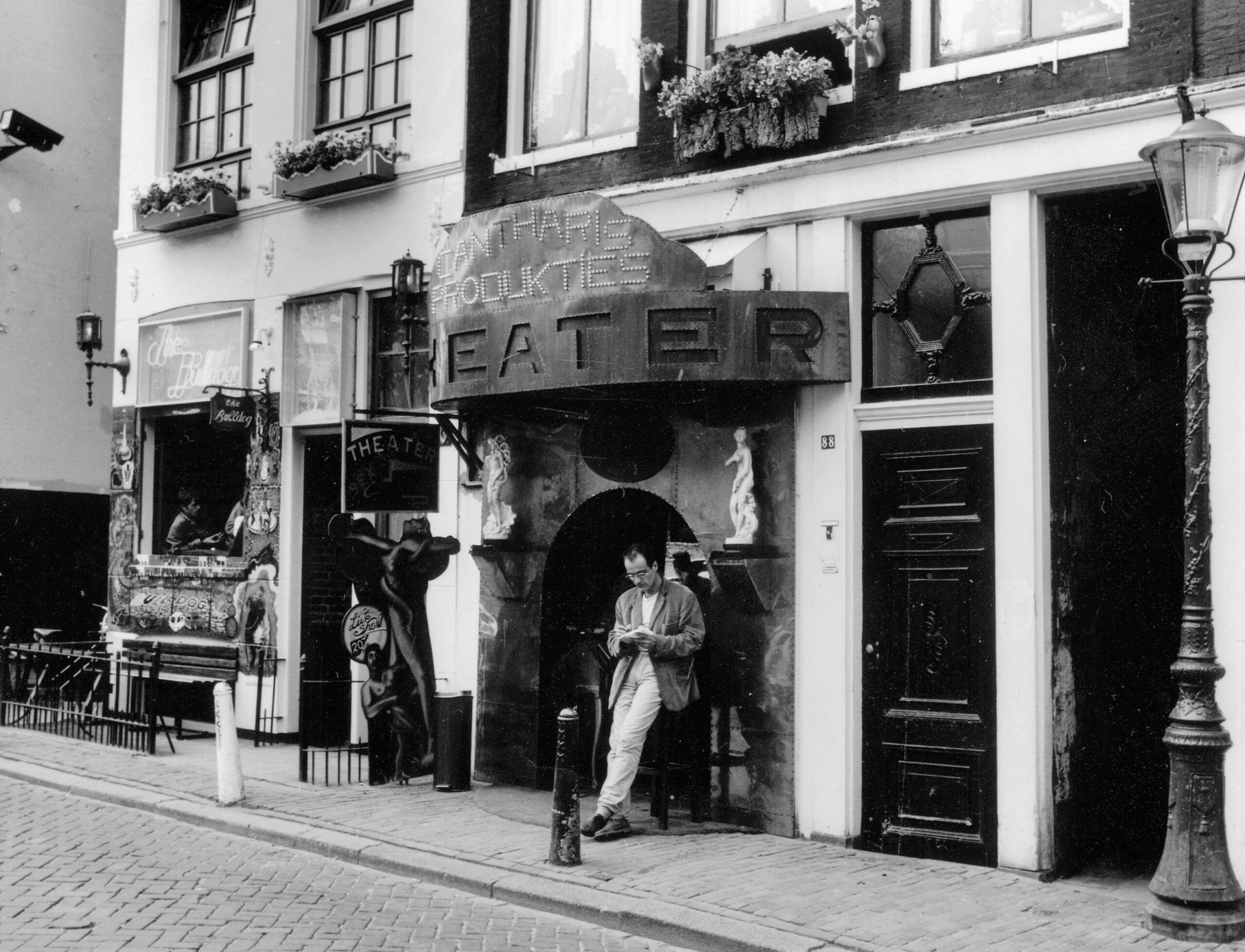 Black and white photo of The Bulldog’s original coffeeshop beside the famous Erotic Theatre in Amsterdam, 1970s. - The Bulldog changed amsterdam
