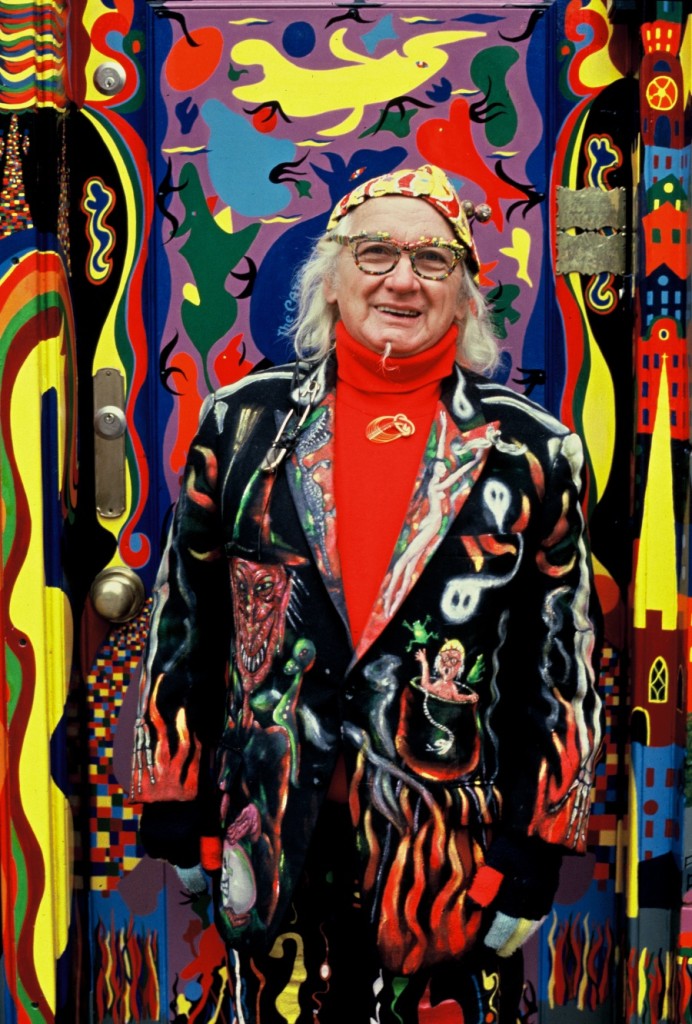 Harold “The Kangaroo” Thornton in his hand-painted suit standing outside The Bulldog coffeeshop mural in Amsterdam.